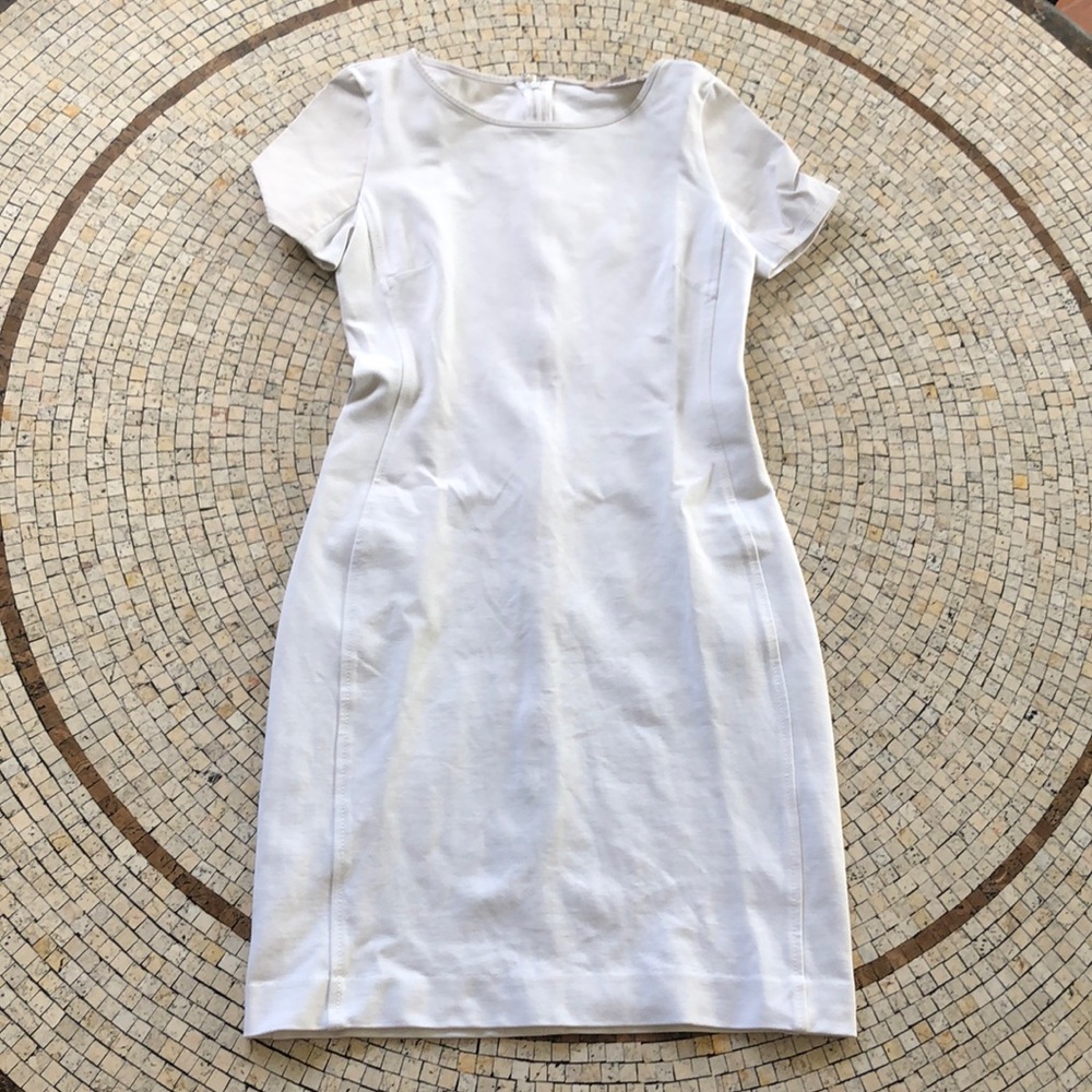 White fitted dress with white leather sleeves